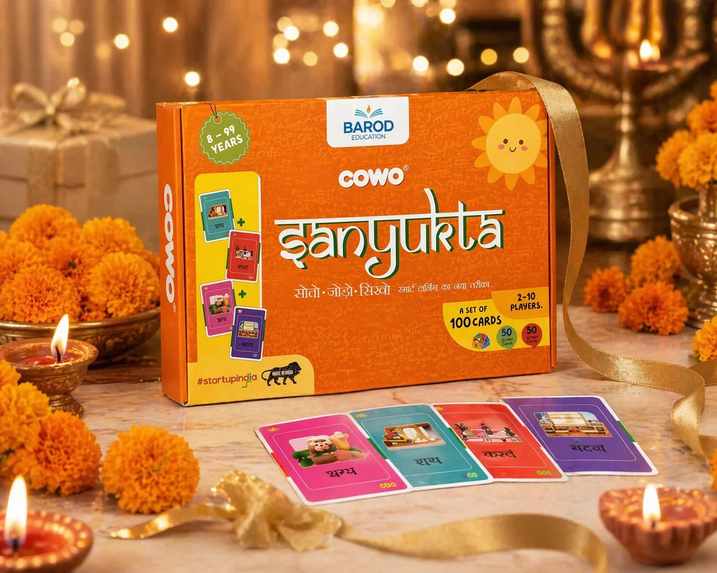 COWO Danyukta Hindi word game box with colorful cards, marigolds, and diya lights for festive learning fun